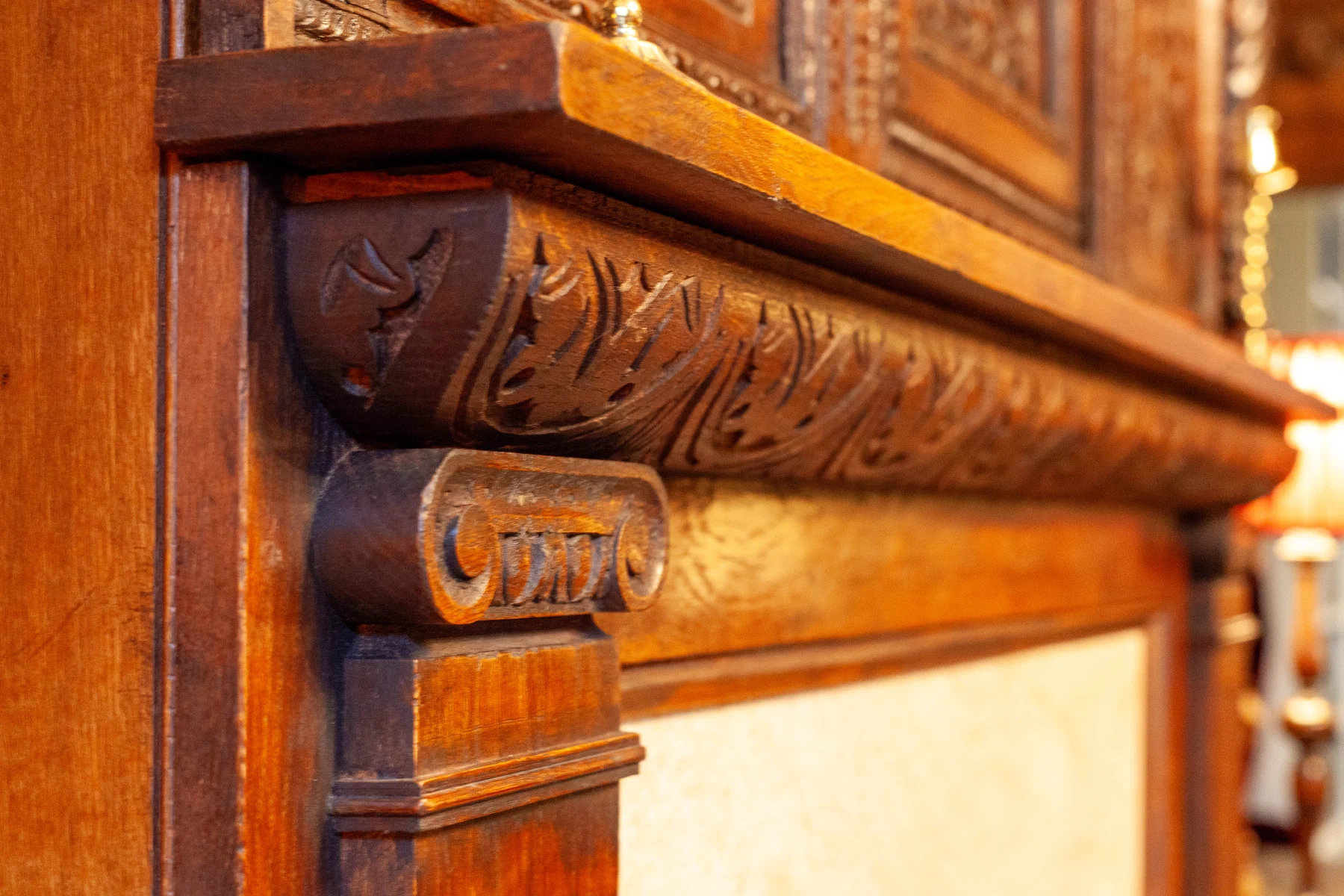 Close view of carved moulding on a timber overmantel