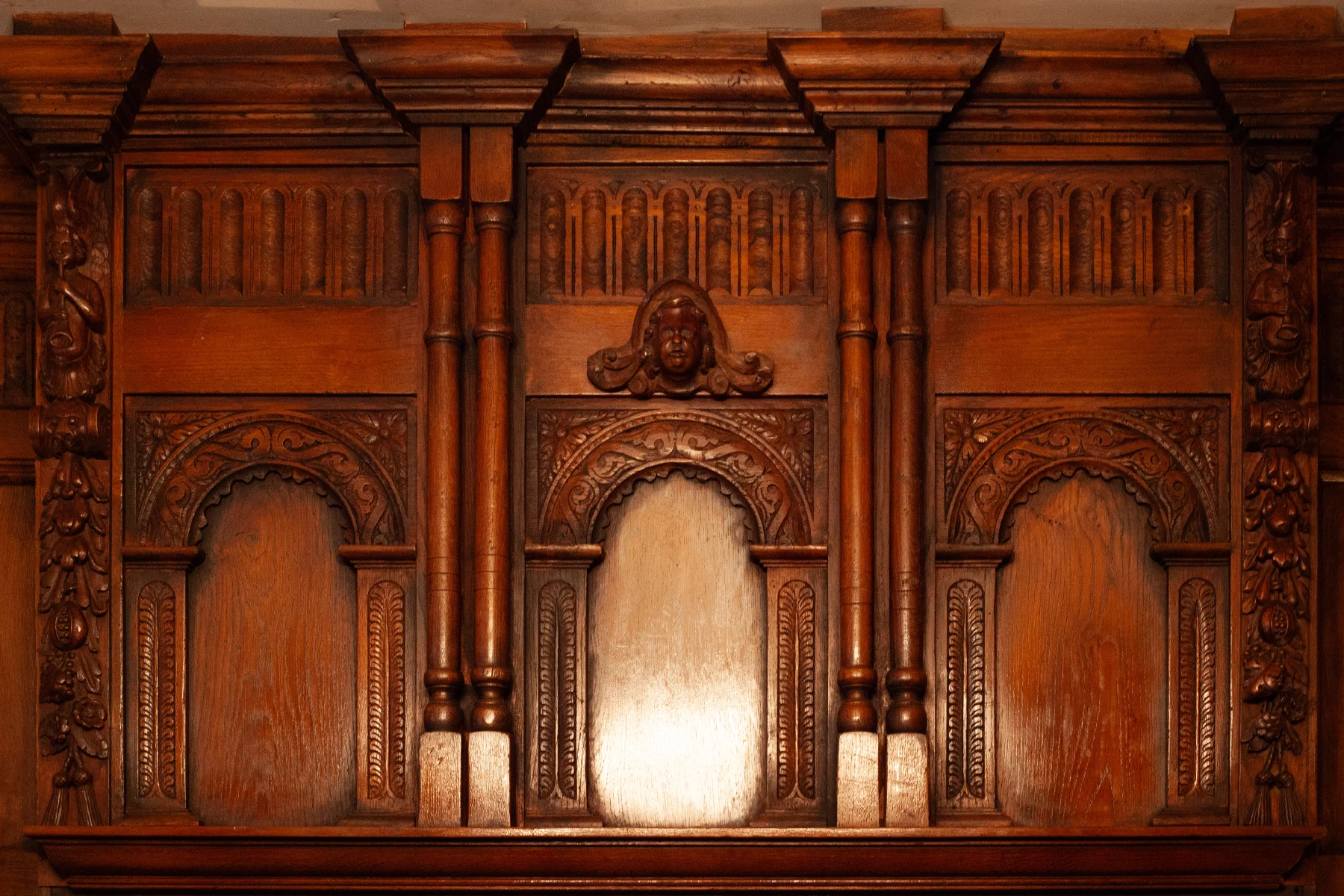 Carved timber panels forming part of an overmantel
