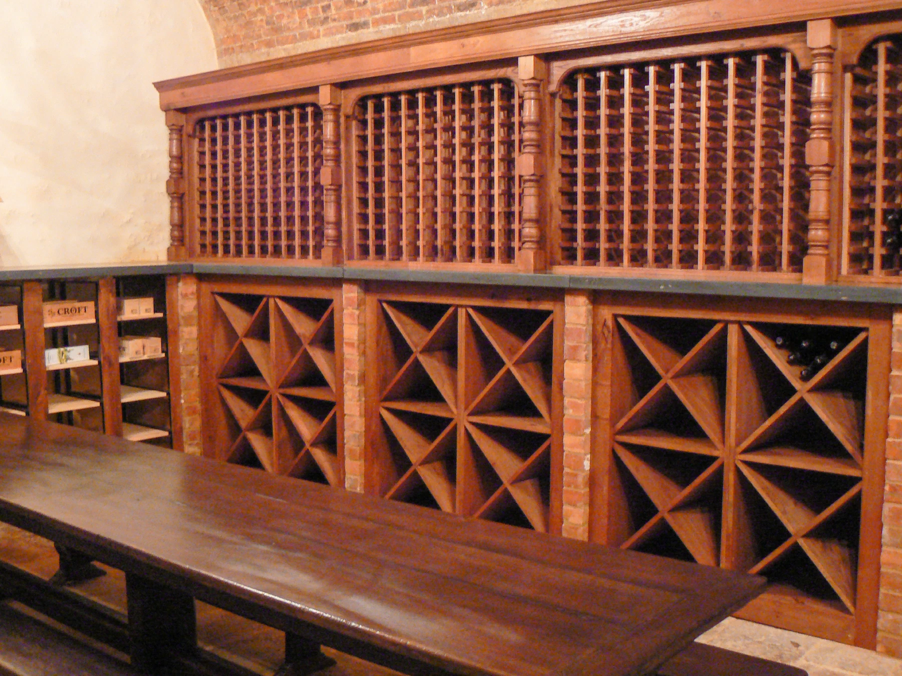 Fitted timber wine storage with individual bottle racks