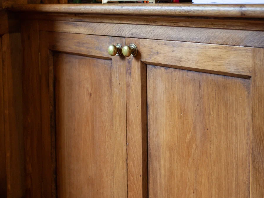 Oak library interior with panelling and fitted shelving