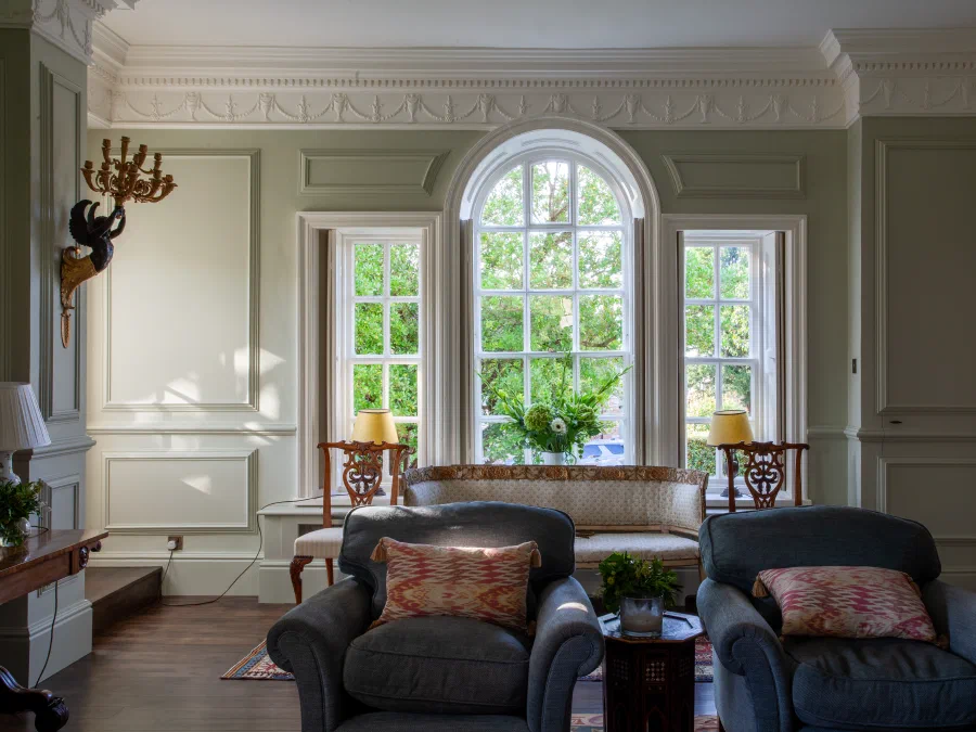 Painted panelling around an arched Georgian window