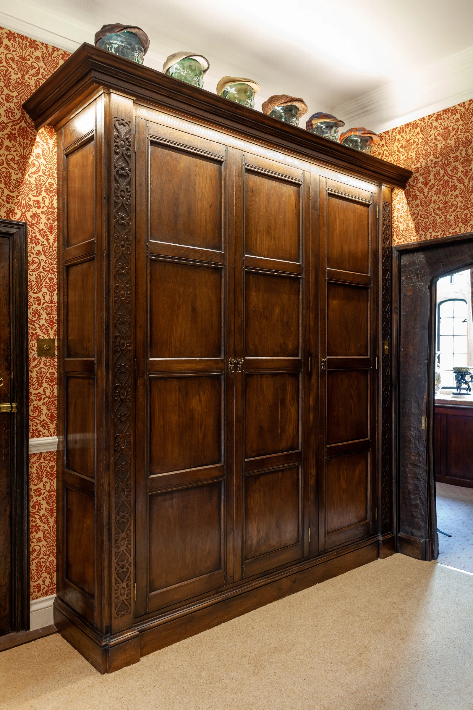 Carved pilaster and panel detail on the Halstock Court dressing room cabinetry