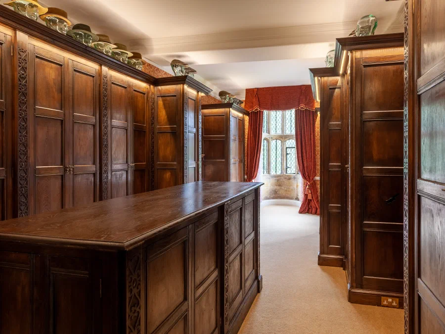 Completed dressing room with panelled wardrobes and central island