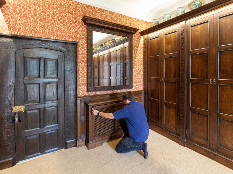Fitting a panelled cupboard door during installation