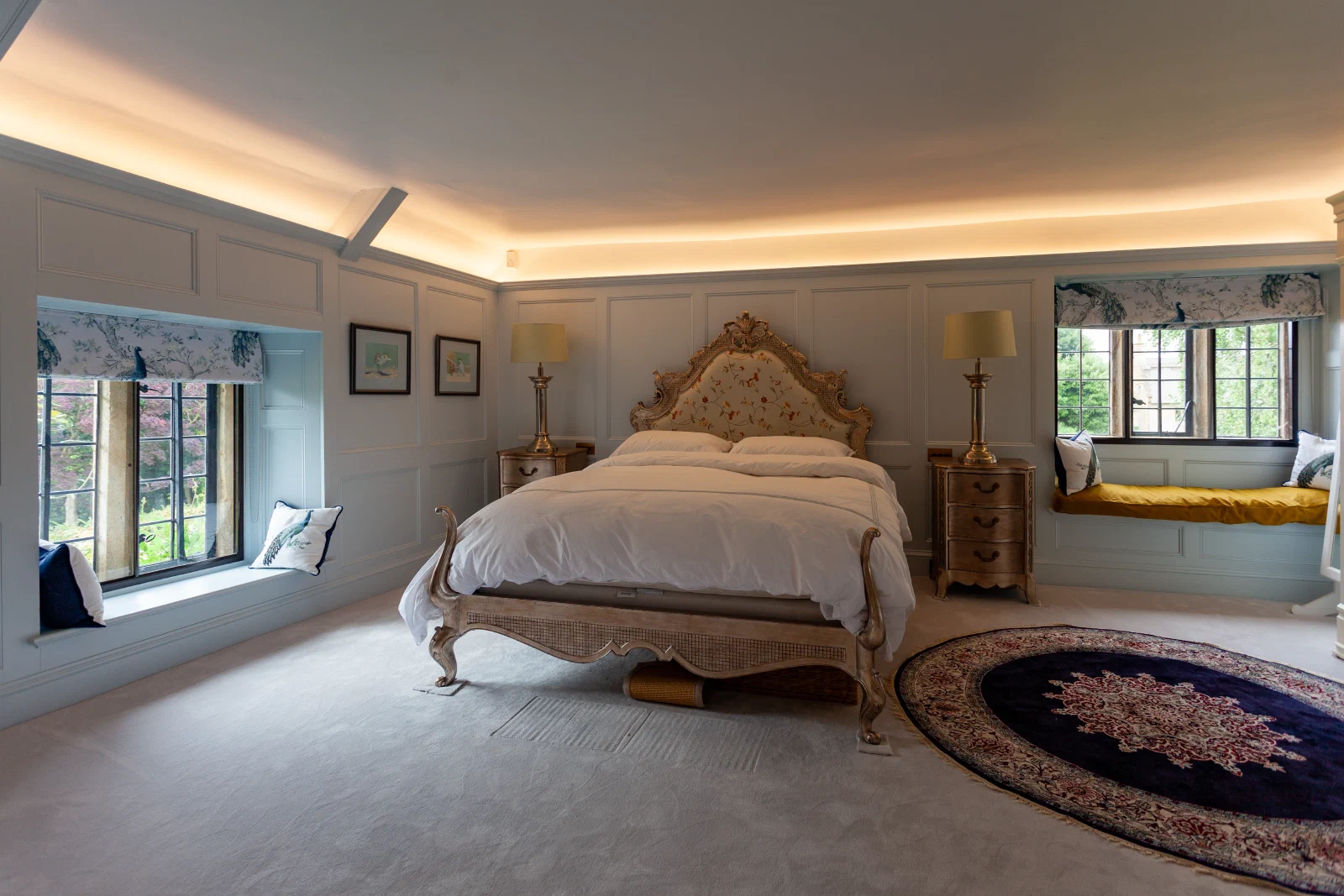 Painted Georgian-style panelling around a cottage bedroom window