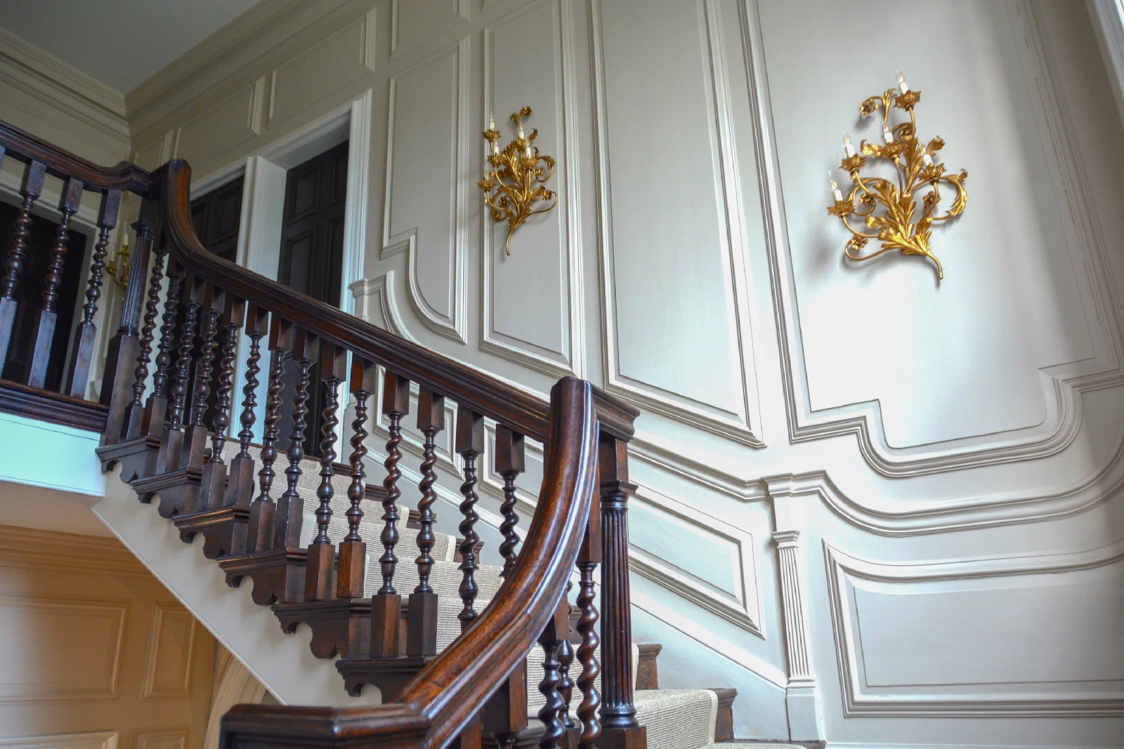 Large painted fielded panels in the Marwood House entrance hall