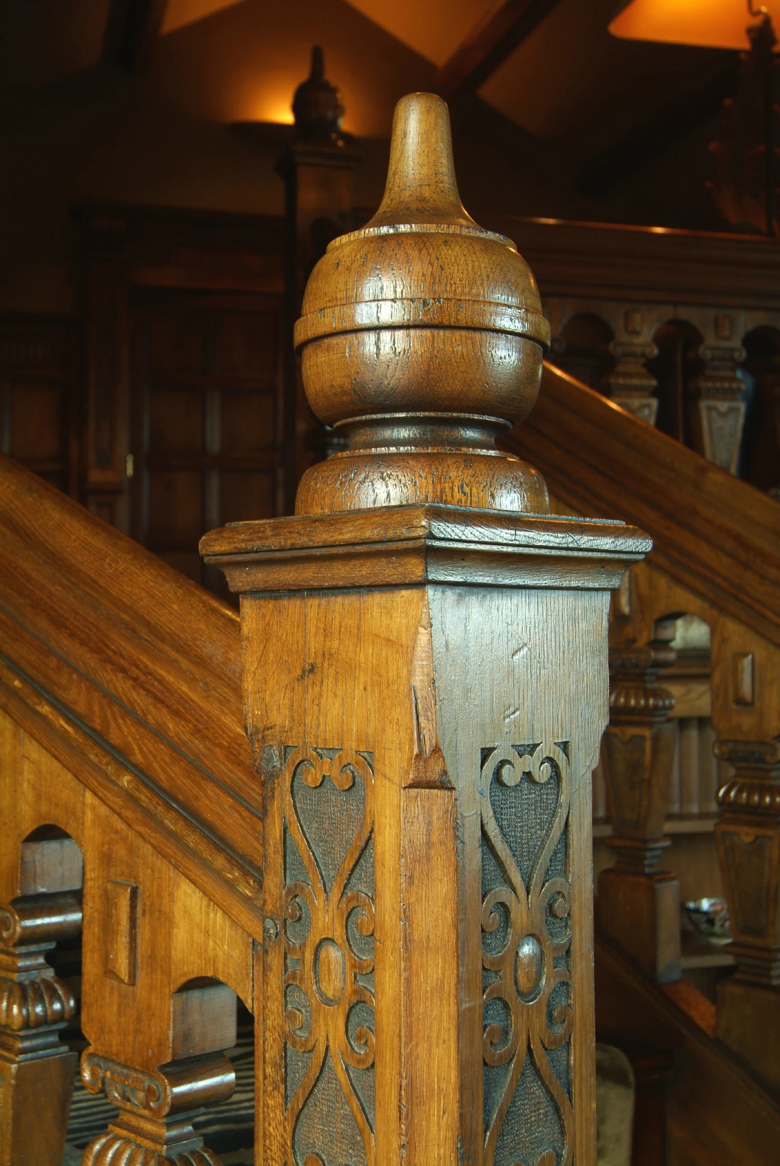 Curved oak staircase with individually carved square balusters