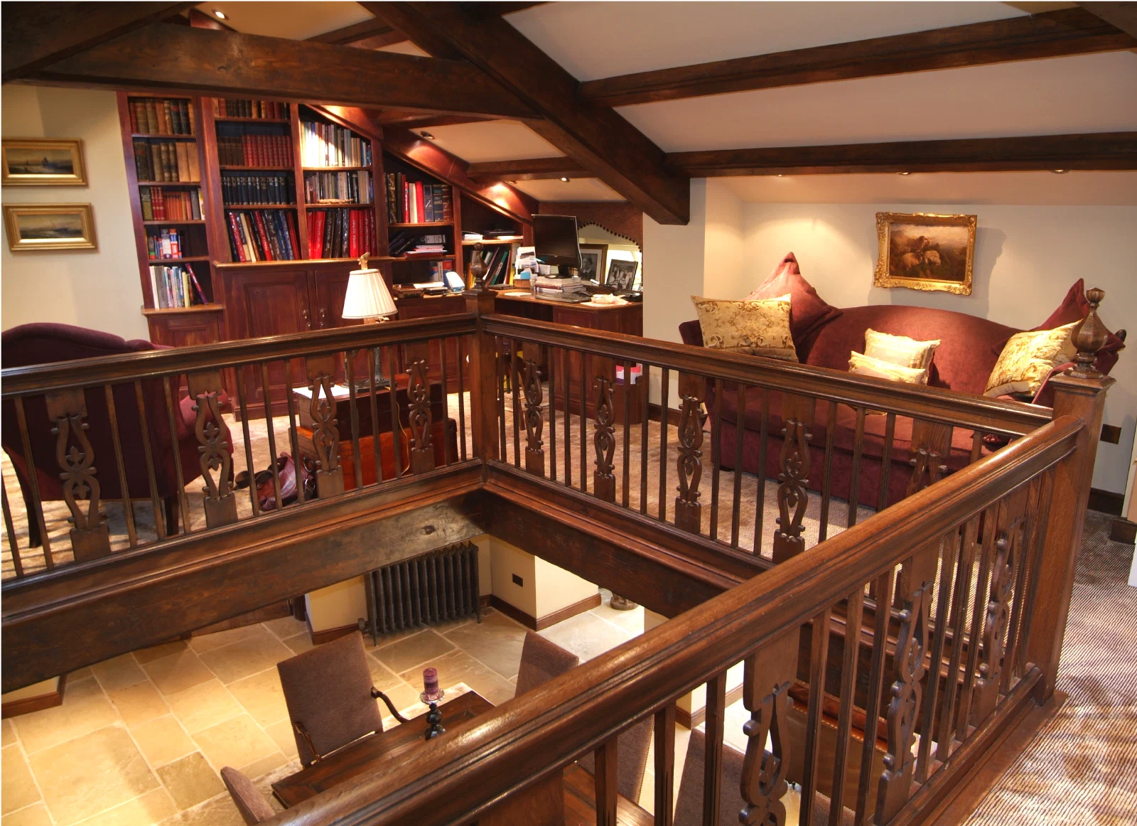 Fitted study bookcases and oak gallery at North Denton Farm