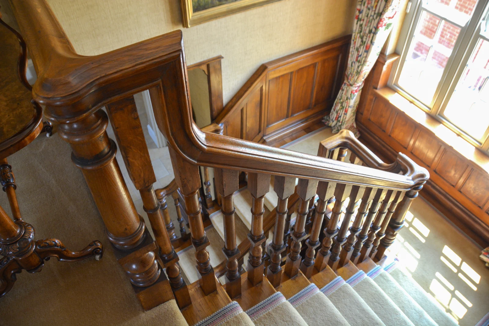 Close view of the shaped oak handrail at Old Oak Hall