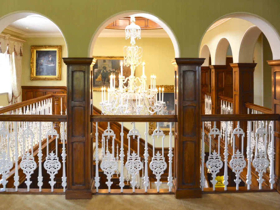 Cast-iron balustrade and oak handrail at landing level