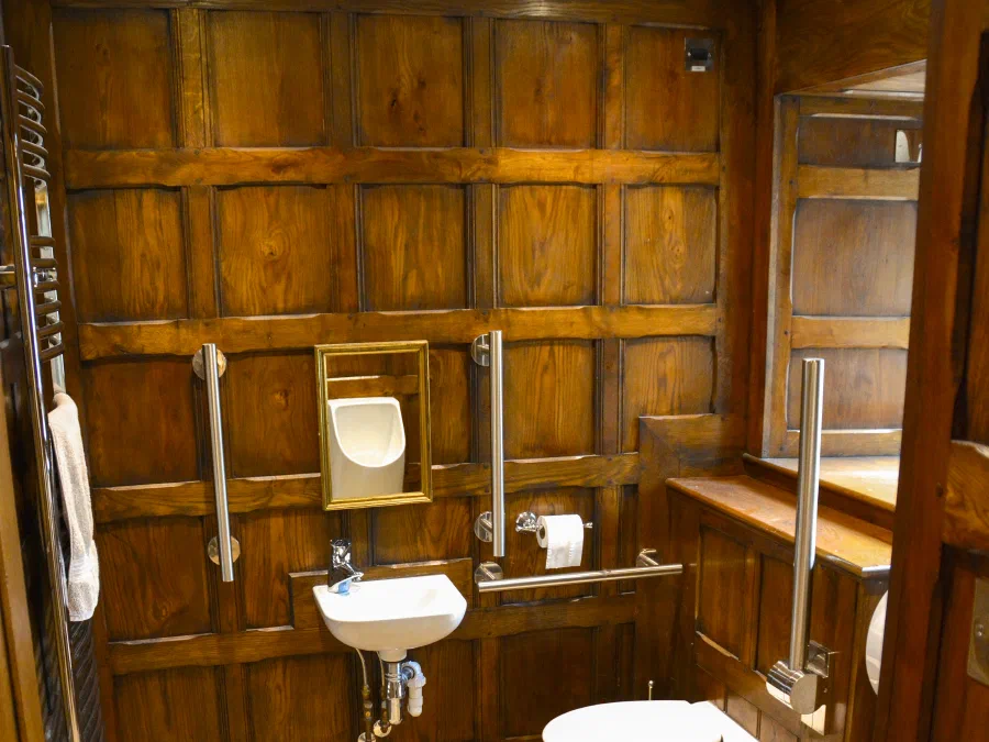 Bathroom with full-height oak panelling