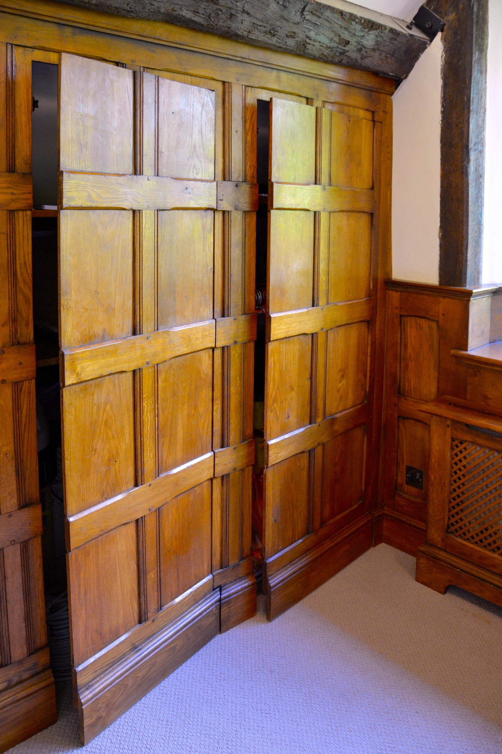 Fitted storage beneath a sloping landing ceiling