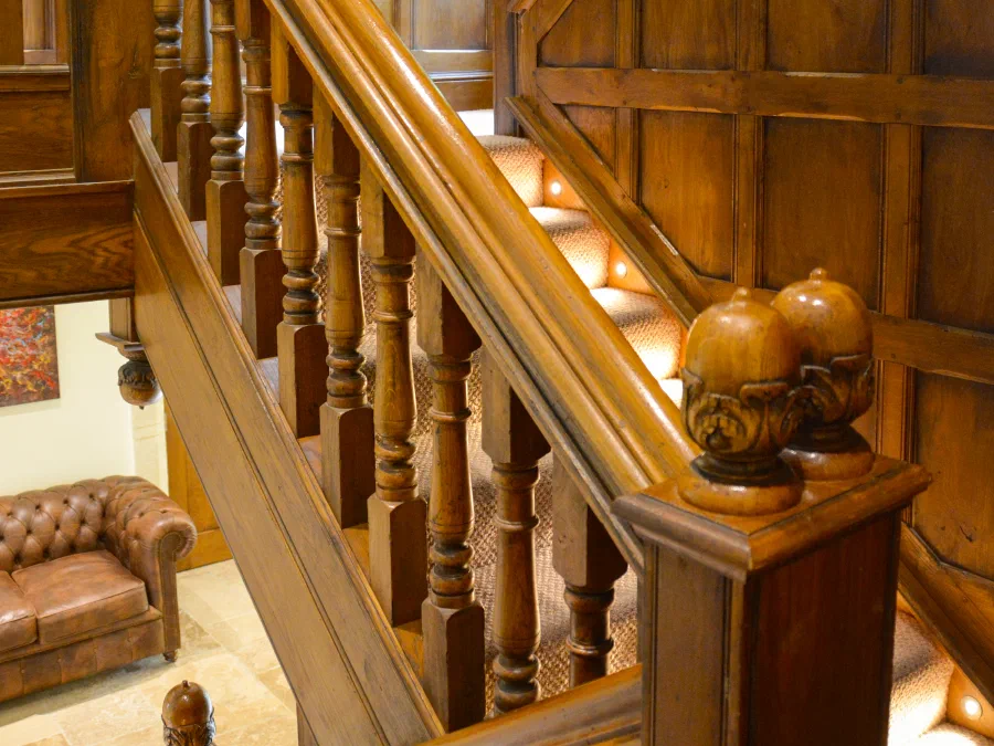 Oak-clad staircase rising between floors
