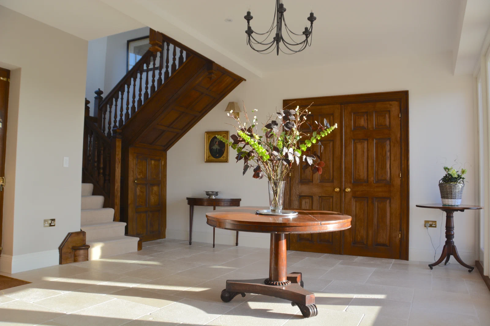Oak staircase, panelled cupboard and double doors at Reed Farmhouse