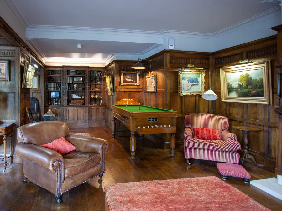 Panelled room with seating and a central table