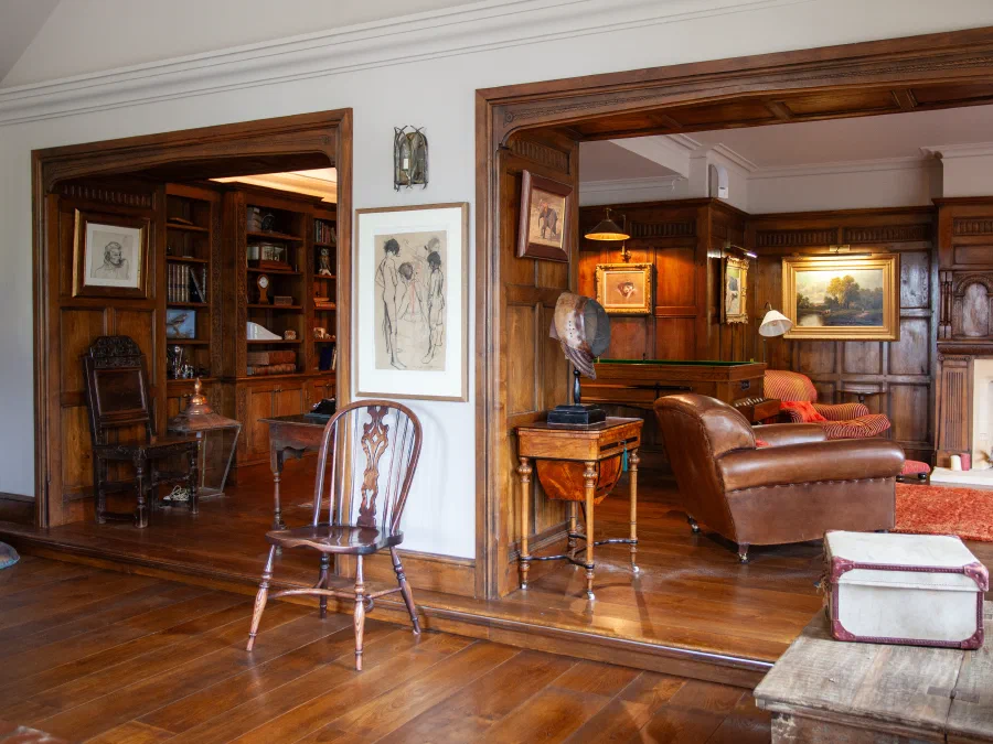 View through a panelled doorway into an adjoining sitting room
