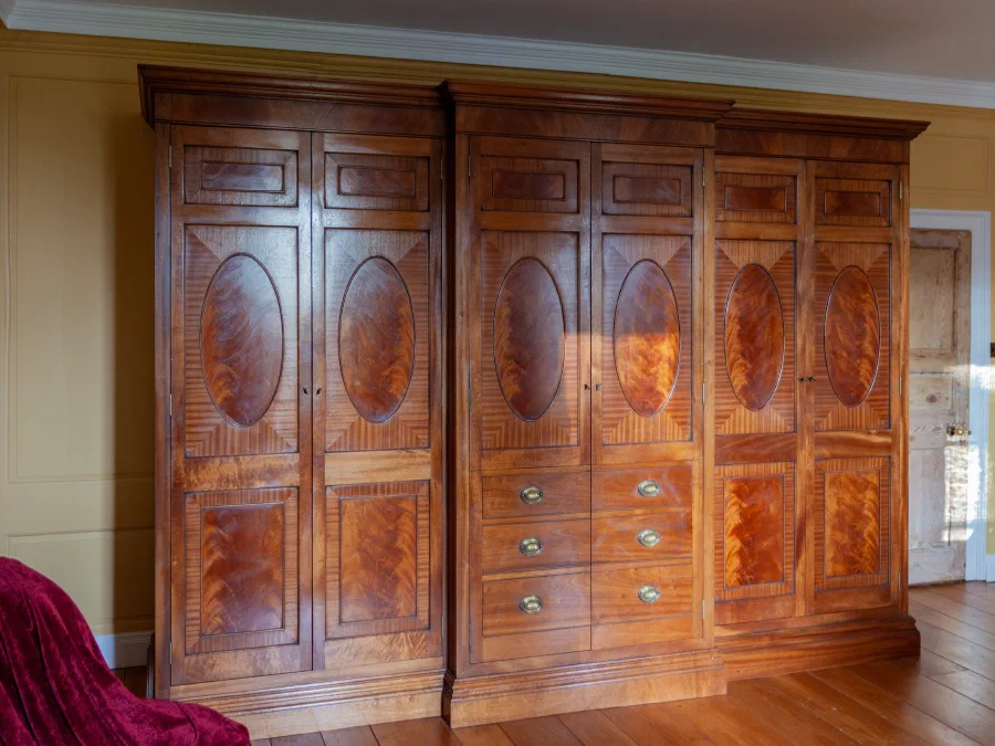 Flame mahogany breakfront wardrobe at Woodside House