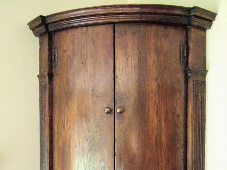 Bowfront corner cupboard with panelled doors