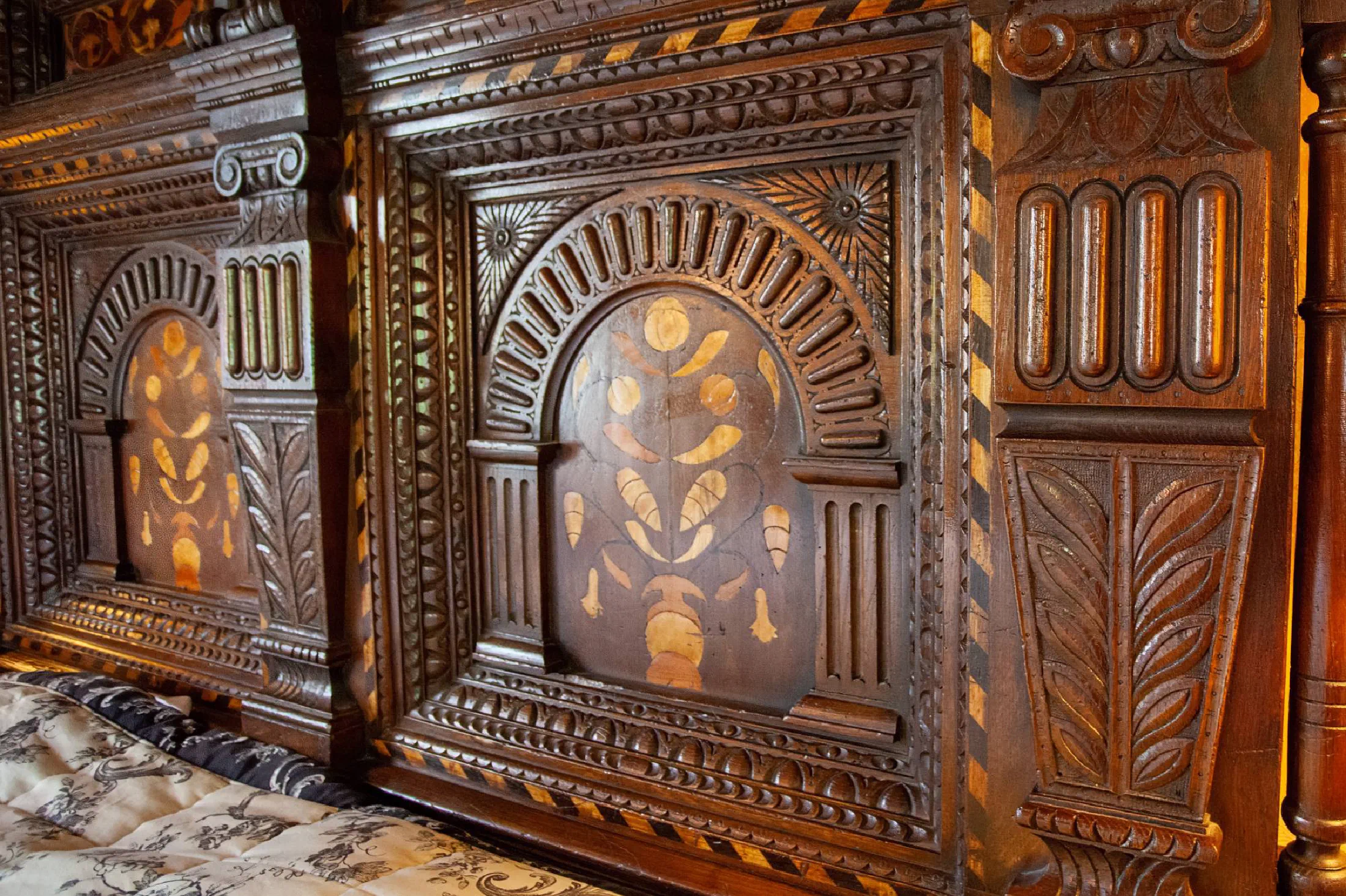 Carved and inlaid oak headboard panel from our replica of the Corbet bed
