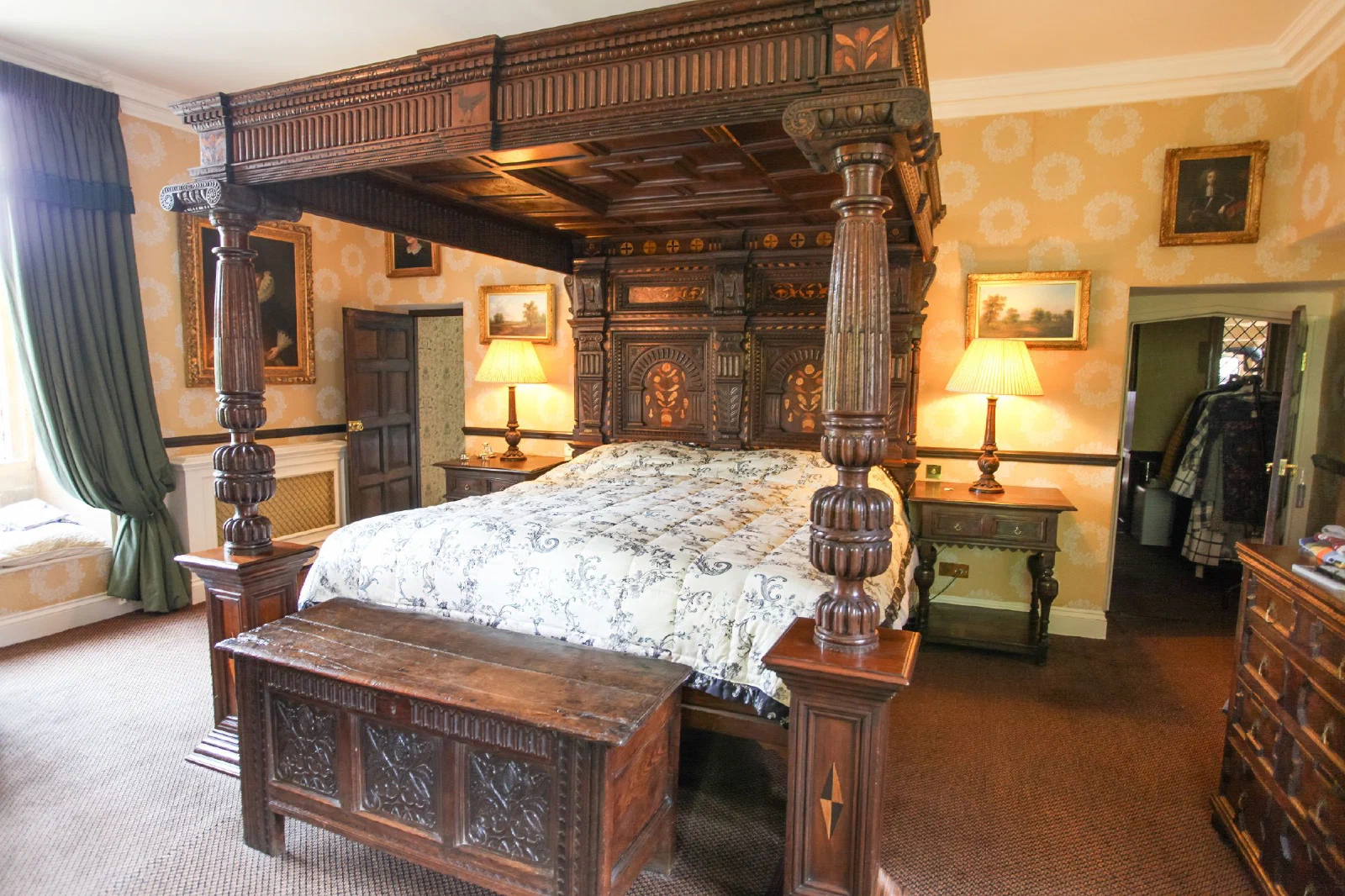 Oak four-poster bed with a carved tester and inlaid headboard, made as a replica of the Corbet bed