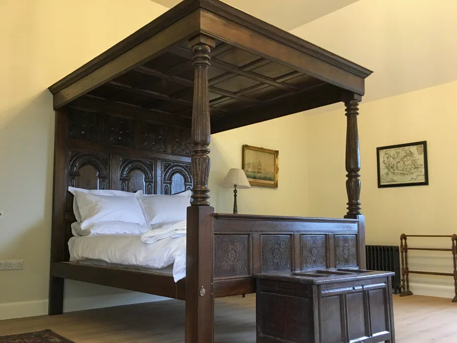 Four-poster bed with a timber tester
