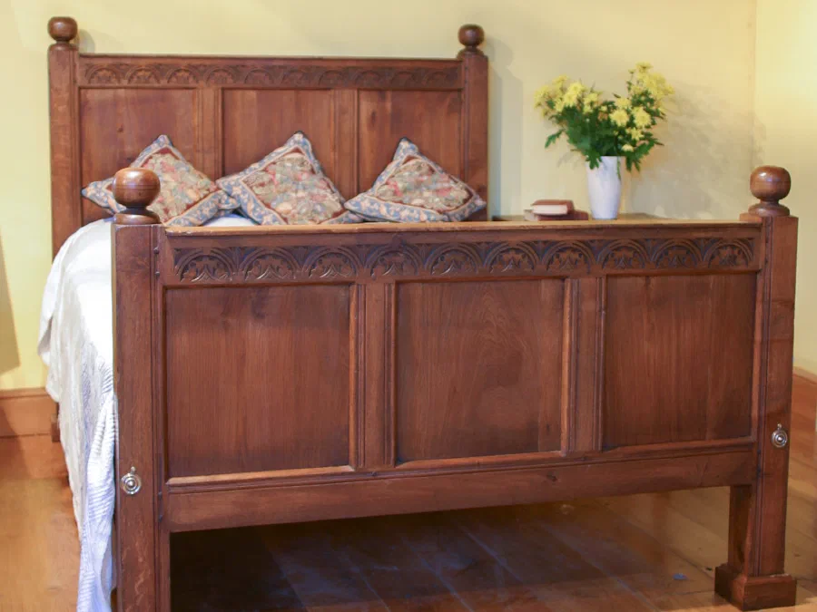 Oak bed with a half-height panelled headboard