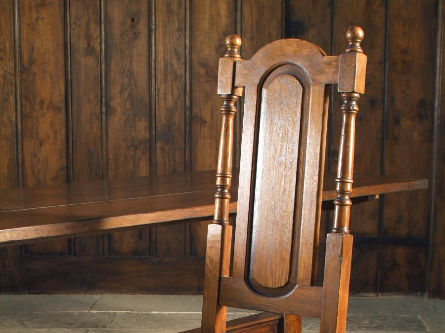 Oak chair with a panelled back and turned legs