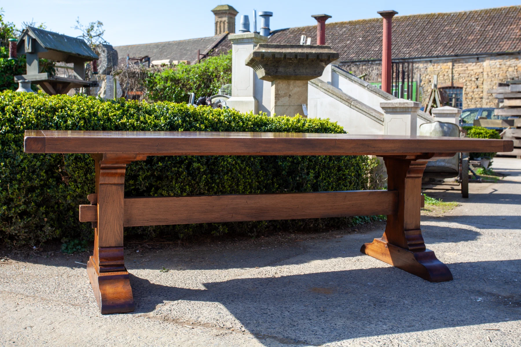 Long oak refectory table with a stretcher base