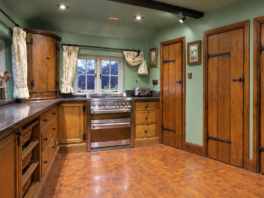 Oak kitchen with plank doors and fitted cabinetry