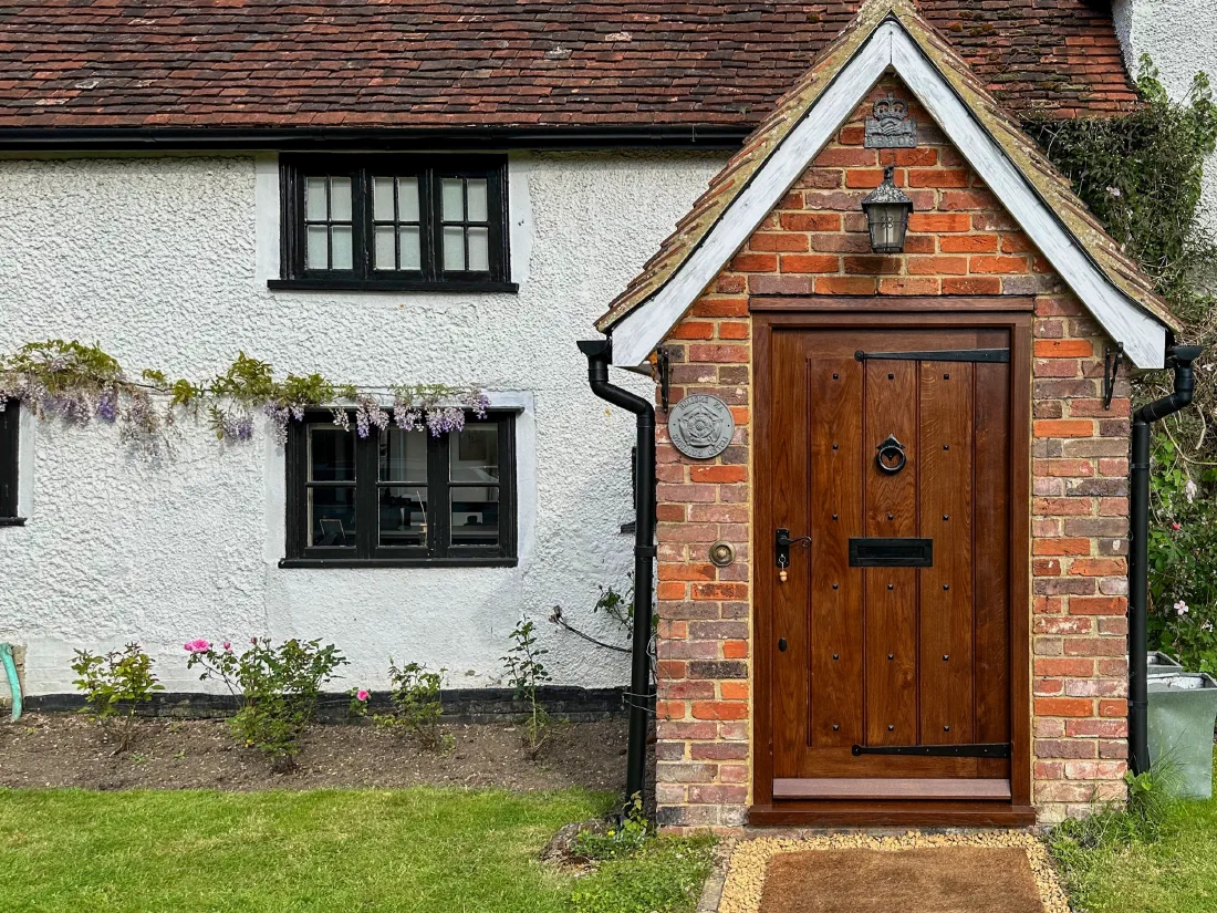 Traditional oak entrance door with surrounding glazed panels