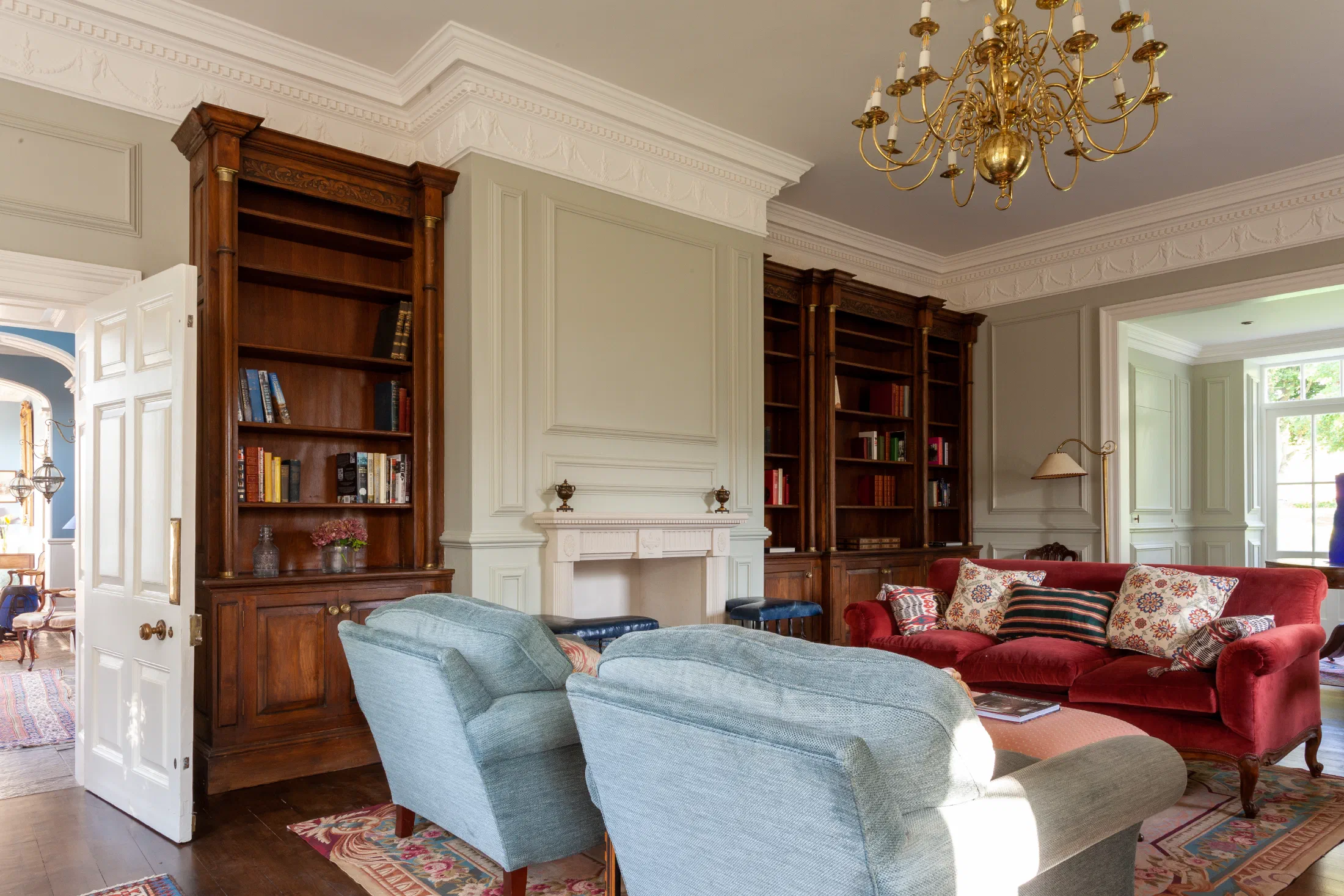 Painted panelling and fitted oak bookcases in a Georgian house