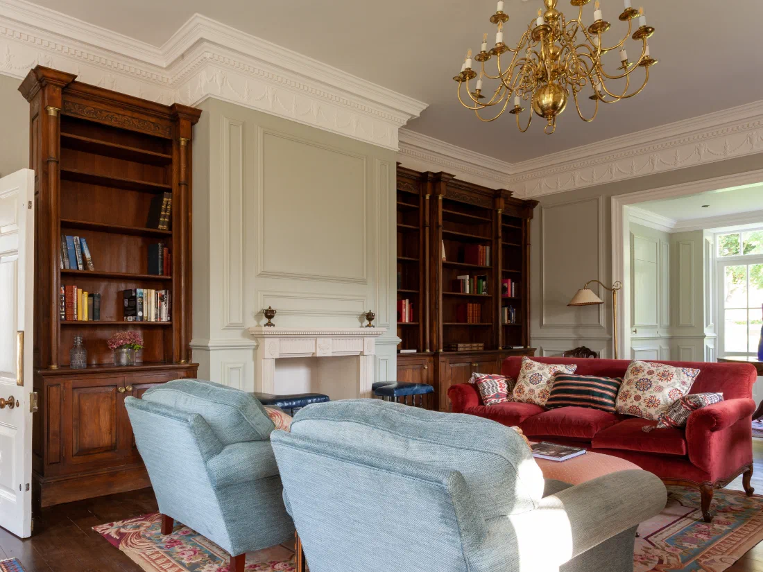 Painted panelling and fitted oak bookcases in a Georgian house