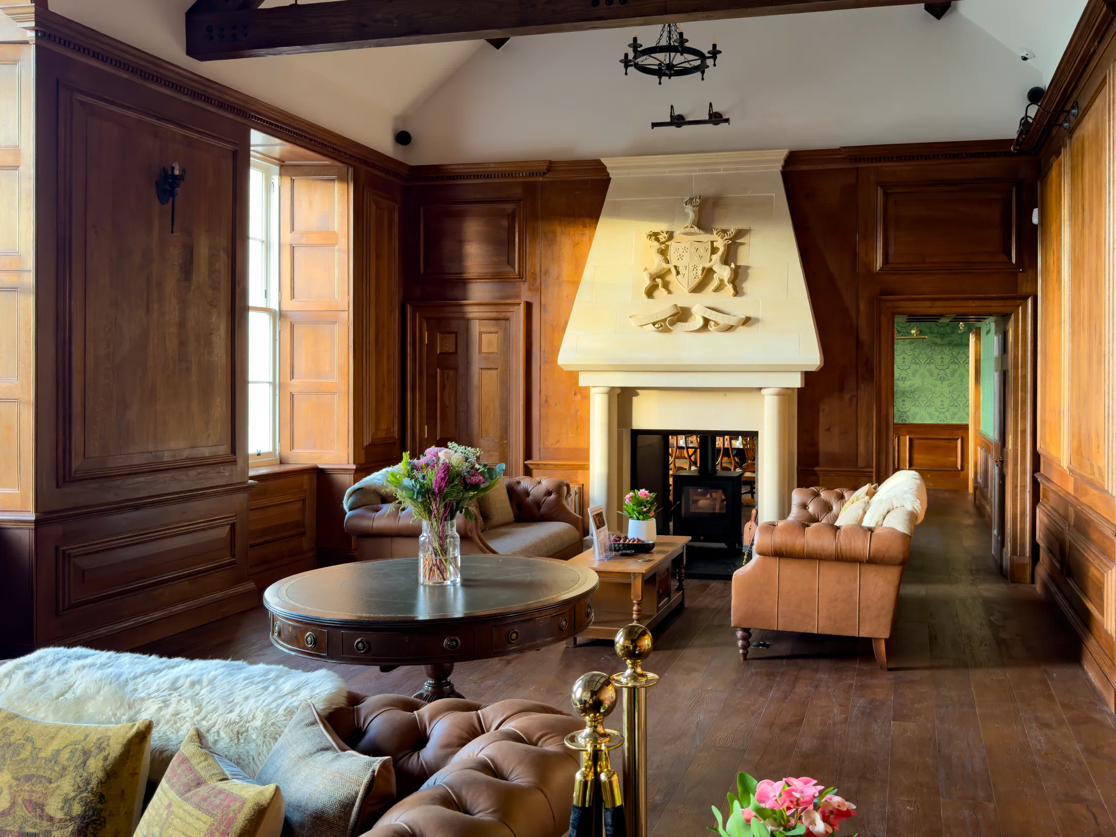 Oak panelled room with a carved stone chimneypiece