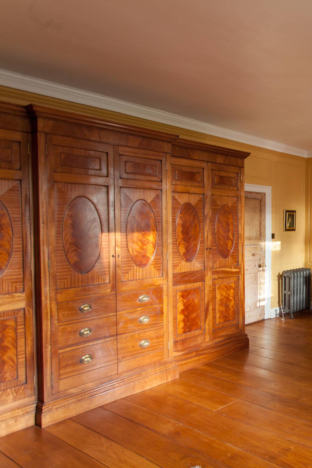 Breakfronted flamed Mahogany wardrobe