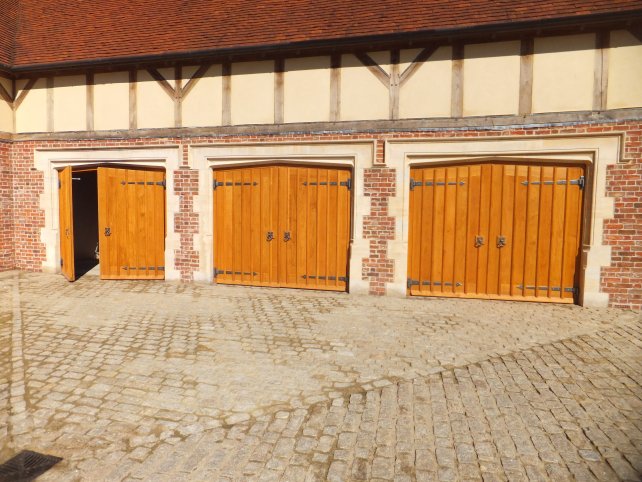 gothic style garage doors with handmade ironwork