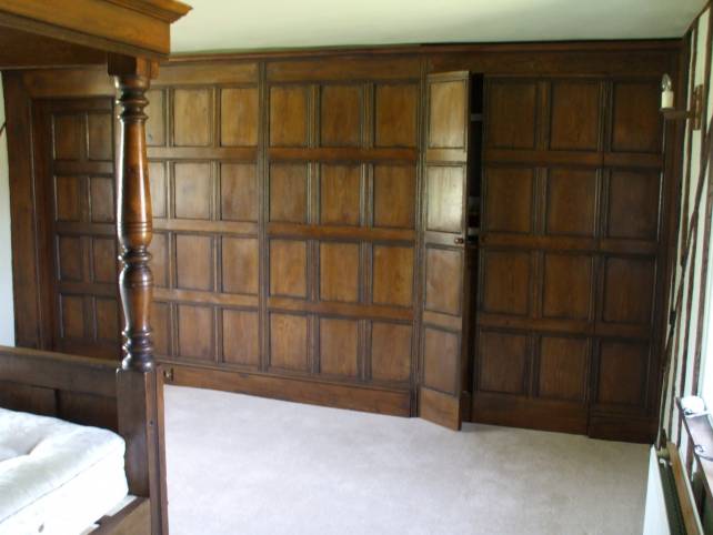 16th century oak room panelling with secret door