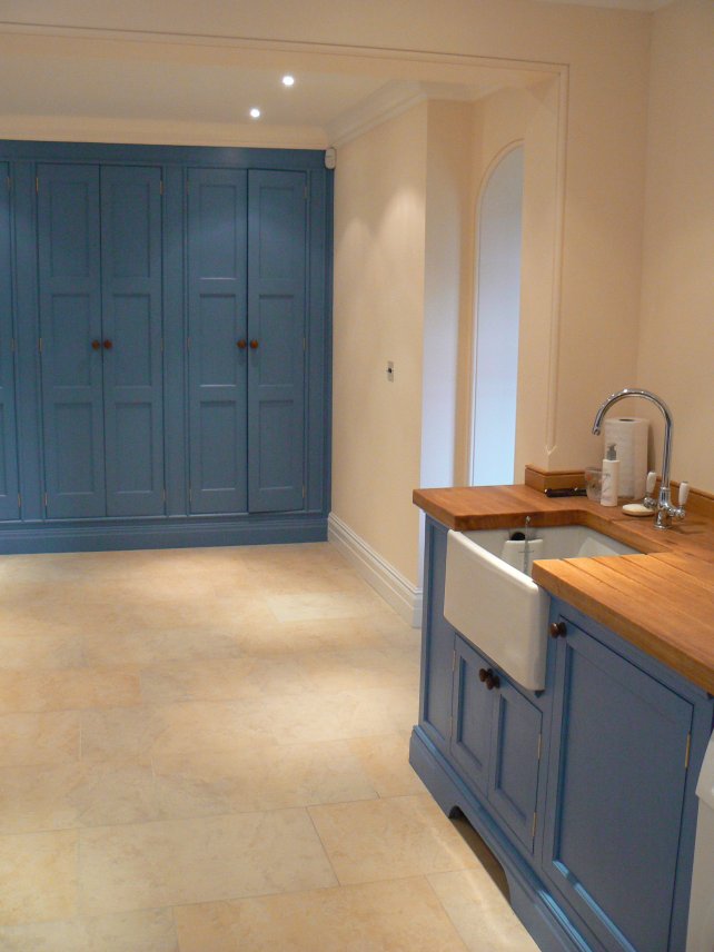 painted utility kitchen with larder unit and Belfast sink, wooden worktops