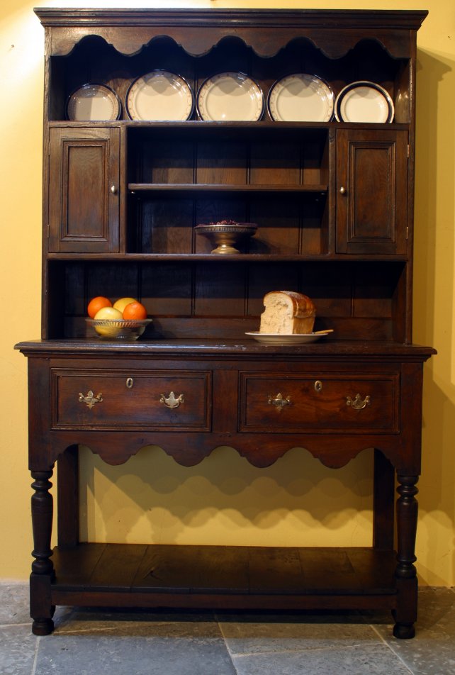 dresser and rack with shaped apron and pot boarded base 