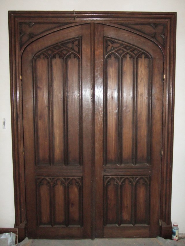 a pair of oak gothic doors, aged and polished 