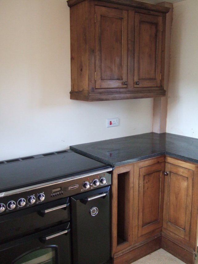 oak kitchen with fielded panels and granite worktop