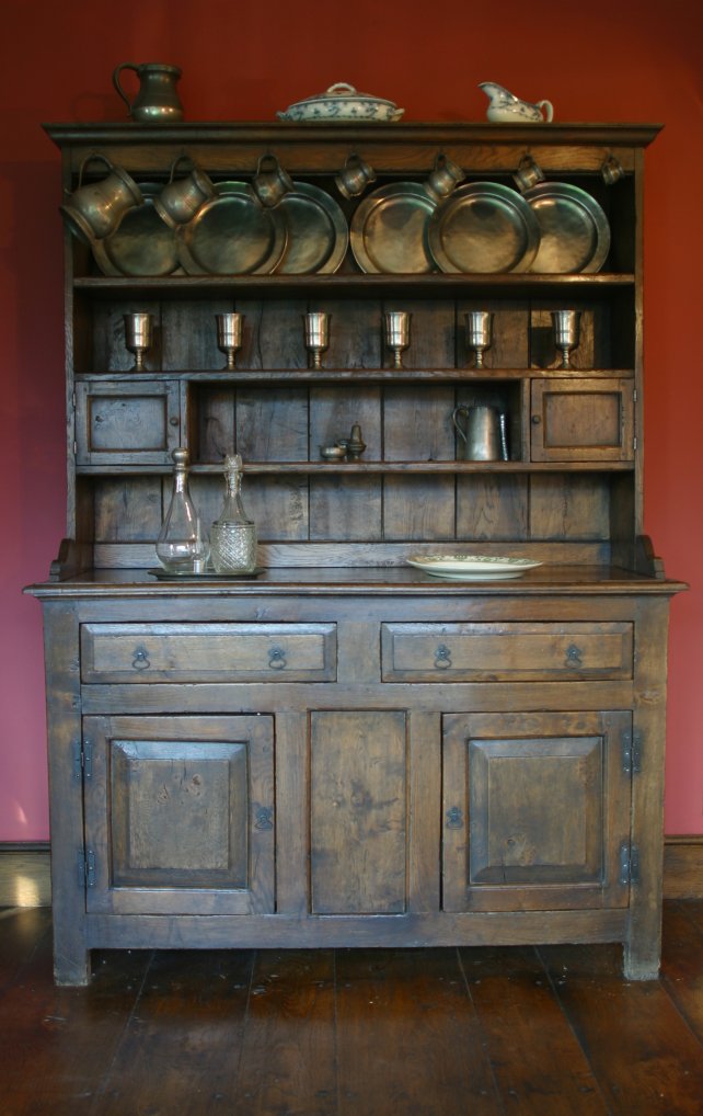 period dresser and rack with fielded panels on doors and drawers