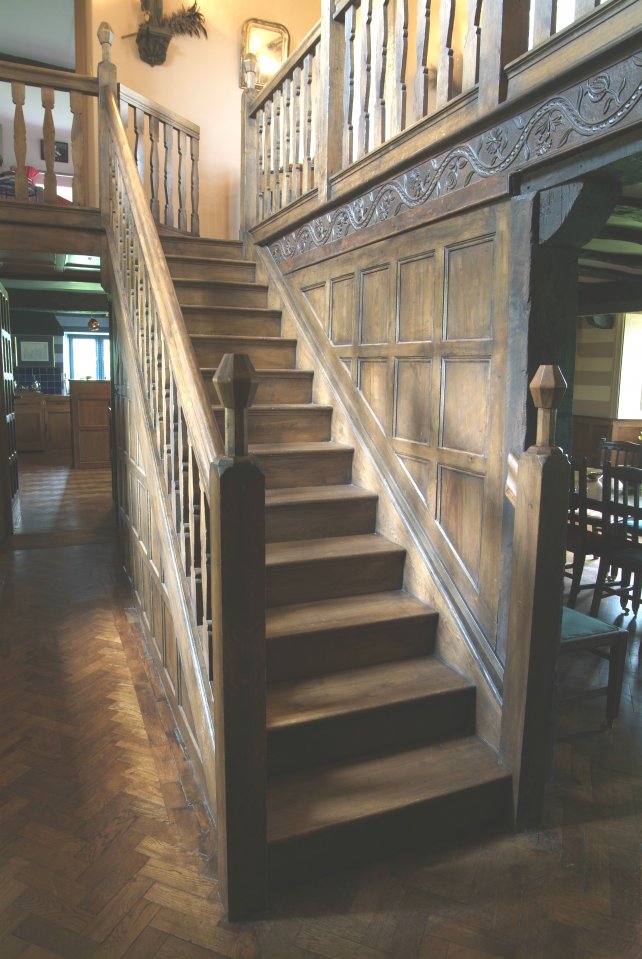 period oak staircase with panelling to the staircase complete with carved apron and gallery landing