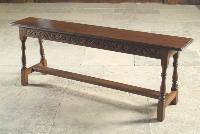 jointed bench with carved rails 