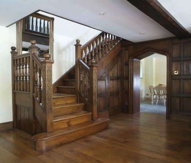 solid oak staircase with hand carved newel posts and hand turned balusters, finials, oak treads and risers