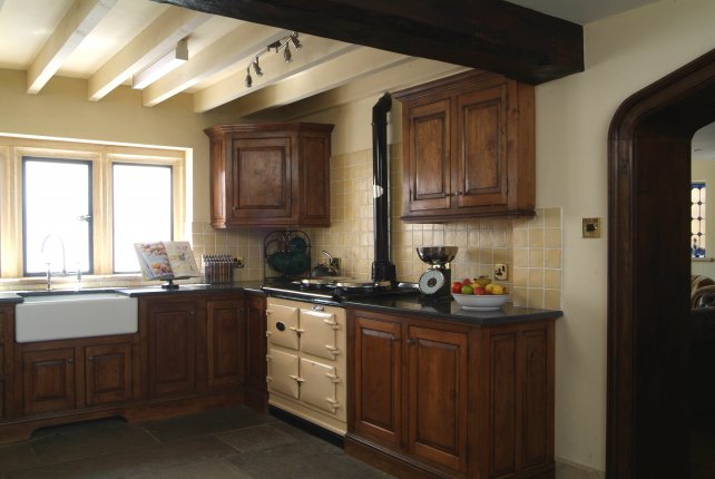 oak kitchen with Aga and flagstone floor