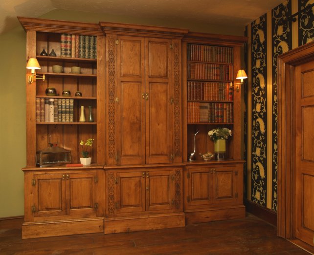 breakfronted bookcase with carved pilasters