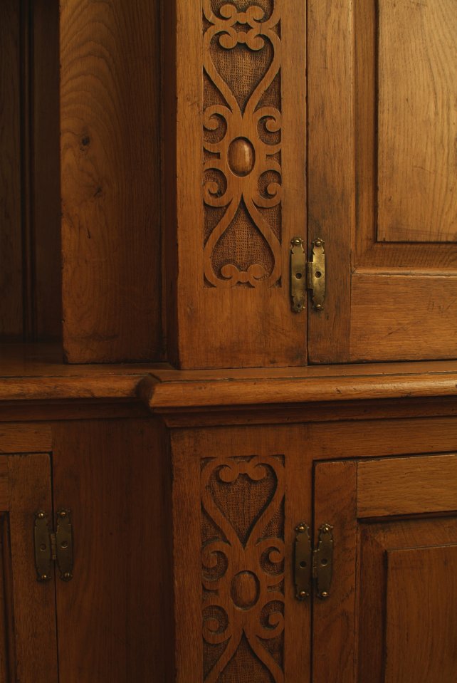 Carved pilasters with fielded door panels