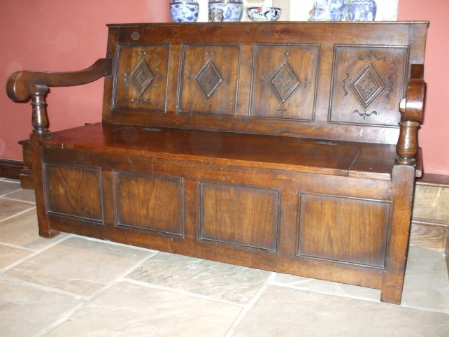 oak settle with hand carved lozenge panels