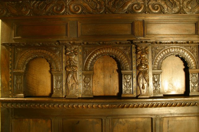 detailing of heavily carved panels and frieze of our four poster bed