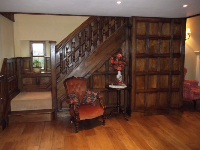 oak panelling and staircase with hand turned spindles